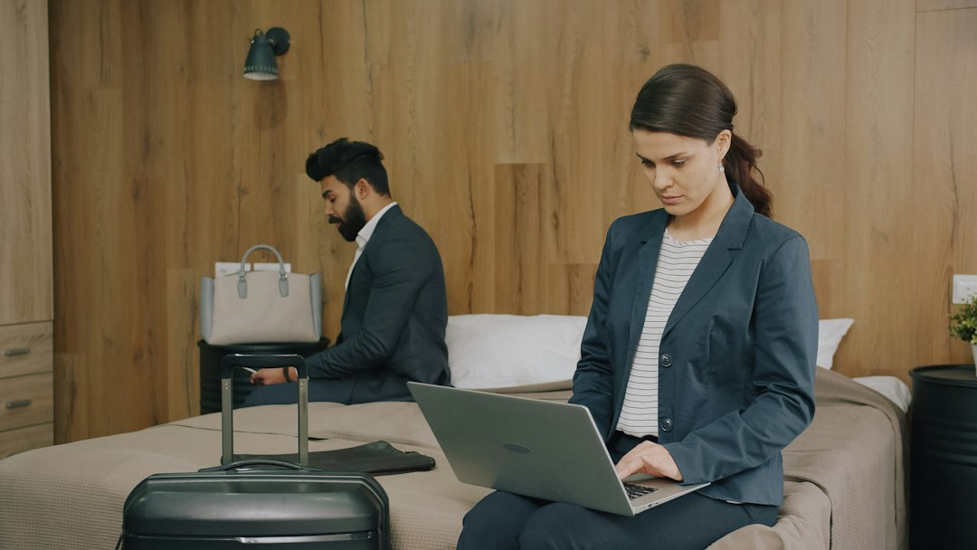 Person using a smartphone and laptop illustrating Android Work Profile apps
